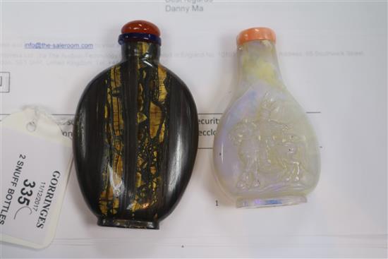 A Chinese carved opal snuff bottle and tigers eye mineral snuff bottle, early 20th century 6.5cm and 7.1cm